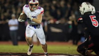 Bolles' Xander Edwards (25) rushes for yards during the second quarter of a high school football matchup at Bishop Kenny High