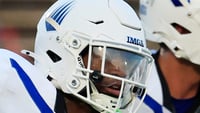 IMG Academy's AJ Marks (1) scampers for a touchdown off a kickoff return during the second quarter of a high school football