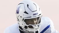 New Palestine Dragons Waynee Estes (25) attempts to tackle IMG Academy Ascenders Jayden Wade (7) as he runs the ball Friday,
