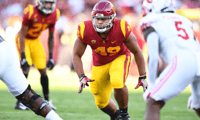 LOS ANGELES, CA - OCTOBER 09: USC Trojans defensive lineman Tuli Tuipulotu (49) looks to runs the passer during a college football game between the Utah Utes and the USC Trojans on October 9, 2021, at Los Angeles Memorial Coliseum in Los Angeles, CA. (Pho