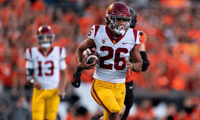 Running back Travis Dye #26 of the USC Trojans rushes the ball against the Oregon State Beavers at Reser Stadium on September 24, 2022 in Corvallis, Oregon. (Photo by Ali Gradischer/Getty Images)