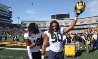 Michigan linemen Mike Morris and Eyabi Okie