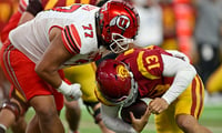 LAS VEGAS, NEVADA - DECEMBER 02: Simote Pepa #77 of the Utah Utes sacks Caleb Williams #13 of the USC Trojans during the third quarter of the PAC-12 Championship football game at Allegiant Stadium on December 02, 2022 in Las Vegas, Nevada. The Utah Utes w