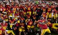 USC Trojans players celebrate on the field after the Trojans defeated the Notre Dame Fighting Irish 38 to 27 in a college football game played on November 26, 2022 at the Los Angeles Memorial Coliseum in Los Angeles, CA. (Photo by John Cordes/Icon Sportsw