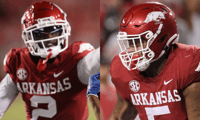 Arkansas DB Dwight McGlothern, DL Cameron Ball