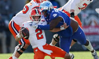 Dec 29, 2023; Jacksonville, FL, USA; Clemson Tigers quarterback Cade Klubnik (2) is brought down by Kentucky Wildcats defensive lineman Deone Walker (0) in the third quarter during the Gator Bowl at EverBank Stadium. Mandatory Credit: Nathan Ray Seebeck-USA TODAY Sports