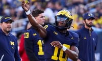 Aug 31, 2024; Ann Arbor, Michigan, USA; Michigan Wolverines quarterback Alex Orji (10) warms up before the game against the Fresno State Bulldogs at Michigan Stadium. Mandatory Credit: Rick Osentoski-USA TODAY Sports