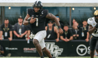 Sep 28, 2024; Orlando, Florida, USA; UCF Knights quarterback KJ Jefferson (1) runs during the second half against the Colorado Buffaloes at FBC Mortgage Stadium. Mandatory Credit: Mike Watters-Imagn Images