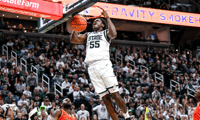 Michigan State's Coen Carr dunks against Bowling Green during the second half on Saturday, Nov. 16, 2024, Breslin Center in East Lansing. (© Nick King/Lansing State Journal / USA TODAY NETWORK via Imagn Images)