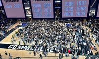 Vanderbilt fans storm the court after the Commodores beat Kentucky (Photo by Tyler Thompson, Kentucky Sports Radio)