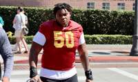 USC center J'Onre Reed walks out to a practice with the Trojans