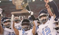 The Bay Port football team celebrates its Wisconsin high school football state championship win over Muskego.