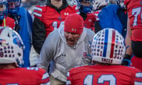 A Cherry Creek assistant coach implores the Bruins' offense against Columbine during a Colorado high school football game.