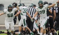 The Eagle Mustangs celebrate a defensive stop in an Idaho high school football game.