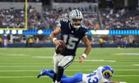 Dallas Cowboys quarterback Will Grier scores on a touchdown run against Los Angeles Rams in the fourth quarter at SoFi Stadium. Credit: Kirby Lee-Imagn Images