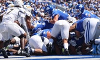 Kentucky football dogpile in the end zone, via Dr. Michael Huang, KSR
