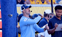West Virginia defensive coordinator Zac Alley calls the play