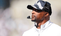 Sep 6, 2025; Cincinnati, Ohio, USA; Bowling Green Falcons head coach Eddie George works to the sideline against the Cincinnati Bearcats in the first half at Nippert Stadium. Mandatory Credit: Aaron Doster-Imagn Images