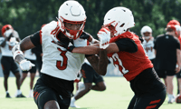 U of L WR Dacari Collins (3) fights to get open on a route on the practice field at Cardinal Stadium in Louisville, Ky. on July 30, 2025.