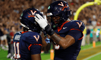 Sep 26, 2025; Charlottesville, Virginia, USA; Virginia Cavaliers wide receiver Trell Harris (11) celebrates with Cavaliers tight end Dakota Twitty (9) after catches a two point conversion as Florida State Seminoles defensive back Jerry Wilson (19) defends in the second overtime period at Scott Stadium. Mandatory Credit: Geoff Burke-Imagn Images