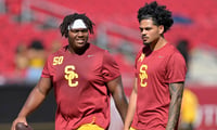 USC Trojans offensive lineman J'Onre Reed (50) quarterback Jayden Maiava (14) warm up prior to the game against the Georgia Southern Eagles at United Airlines Field at Los Angeles Memorial Coliseum