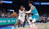 Oct 9, 2025; Oklahoma City, Oklahoma, USA; Oklahoma City Thunder guard Cason Wallace (22) drives around Charlotte Hornets guard Lamelo Ball (1) during the second quarter of a game between the Charlotte Hornets and the Oklahoma City Thunder at Paycom Center. Mandatory Credit: Alonzo Adams-Imagn Images