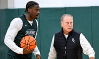 Michigan State's coach Tom Izzo, left, talks with Coen Carr, left, and Denham Wojcik during the first day of basketball practice on Monday, Sept. 22, 2025, at the Breslin Center in East Lansing. - Nick King, USA TODAY Sports