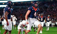 Virginia QB Chandler Morris celebrates a touchdown in the Cavaliers’ 2OT shootout against Florida State. (Geoff Burke / Imagn Images)