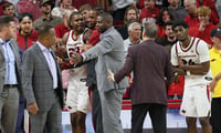 John Calipari had to restrain Arkansas forward Nick Pringle at the end of a nail-biting win over Winthrop, via Nelson Chenault-Imagn Images