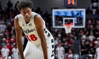 Nov 11, 2025; Cincinnati, Ohio, USA; Cincinnati Bearcats forward Baba Miller (18) stands on the court against the Dayton Flyers in the second half at Fifth Third Arena. Mandatory Credit: Aaron Doster-Imagn Images