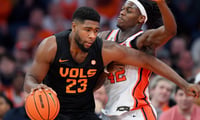 Dec 2, 2025; Syracuse, New York, USA; Tennessee Volunteers forward Jaylen Carey (23) drives against Syracuse Orange forward William Kyle III (42) during the second half at the JMA Wireless Dome. Mandatory Credit: Rich Barnes-Imagn Images