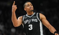 Nov 18, 2025; San Antonio, Texas, USA; San Antonio Spurs forward Keldon Johnson (3) celebrates in the second half against the Memphis Grizzlies at Frost Bank Center. Mandatory Credit: Daniel Dunn-Imagn Images