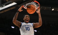 Brandon Garrison throws down a dunk during a Kentucky NCAA Tournament win over Santa Clara, via Jeff Curry-Imagn Images
