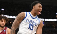 Mar 20, 2026; St. Louis, MO, USA; Kentucky Wildcats forward Brandon Garrison (10) reacts after dunking the ball against Santa Clara Broncos forward Allen Graves (22) during the second half of a first round game of the men's 2026 NCAA Tournament at Enterprise Center. Mandatory Credit: Jeff Curry-Imagn Images