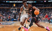 Mar 21, 2026; Buffalo, NY, USA; Louisville Cardinals guard Ryan Conwell (3) drives the ball against Michigan State Spartans forward Coen Carr (55) in the first half during a second round game of the men's 2026 NCAA Tournament at Keybank Center. Mandatory Credit: Gregory Fisher-Imagn Images