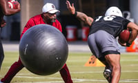 South Carolina running backs coach/assistant head coach Stan Drayton running a drill with quarterback LaNorris Sellers. (Katie Dugan/GamecockCentral)