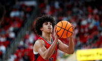 Dec 6, 2025; Raleigh, North Carolina, USA; Liberty Flames guard Brett Decker Jr. (4) shoots a free throw during the second half of the game against the NC State Wolfpack at Lenovo Center. Mandatory Credit: Jaylynn Nash-Imagn Images