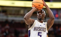 Mar 11, 2026; Chicago, IL, USA; Washington Huskies guard Zoom Diallo (5) shoots a free throw against the Southern California Trojans during the overtime at United Center. Mandatory Credit: Kamil Krzaczynski-Imagn Images