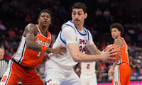 Michigan State and former Southern Methodist University Mustangs center Samet Yigitoglu (24) handles the ball against Syracuse Orange forward Donnie Freeman (1) during the first half at Spectrum Center. - Jim Dedmon, USA TODAY Sports