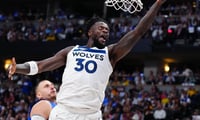 Apr 20, 2026; Denver, Colorado, USA; Minnesota Timberwolves forward Julius Randle (30) finishes off a basket in the first half against the Denver Nuggets during game two of the first round of the 2026 NBA Playoffs at Ball Arena. Mandatory Credit: Ron Chenoy-Imagn Images