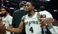 Apr 26, 2026; Portland, Oregon, USA; San Antonio Spurs guard De'aaron Fox (4) celebrates with teammates after a game against the Portland Trail Blazers during game four of the first round of the 2026 NBA Playoffs at Moda Center. Mandatory Credit: Troy Wayrynen-Imagn Images