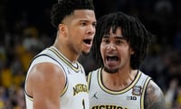 Michigan Michigan guard Trey McKenney (1) and guard Elliot Cadeau (3) react to a play during the second half of the NCAA national championship game against Connecticut at Lucas Oil Stadium in Indianapolis on Monday, April 6, 2026.