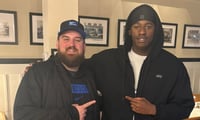 Ian Walker poses with Kentucky offensive line coach Cutter Leftwich (Photo provided by Ian Walker)