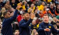 Michigan Wolverines basketball assistant coaches Mike Boynton Jr., Akeem Miskdeen and Kyle Church. (Photo by Junfu Han / USA TODAY NETWORK via Imagn Images)