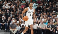 May 24, 2026; San Antonio, Texas, USA; San Antonio Spurs guard De'Aaron Fox (4) moves the ball up court in the first quarter against the Oklahoma City Thunder during game four of the western conference finals for the 2026 NBA playoffs at Frost Bank Center. Mandatory Credit: Daniel Dunn-Imagn Images
