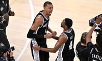 May 30, 2026; Oklahoma City, Oklahoma, USA; San Antonio Spurs forward Victor Wembanyama (1) celebrates with guard De'aaron Fox (4) after defeating the Oklahoma City Thunder in game seven of the western conference finals for the 2026 NBA playoffs at Paycom Center. Mandatory Credit: Jerome Miron-Imagn Images