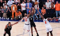 Jun 8, 2026; New York, New York, USA; San Antonio Spurs guard De'aaron Fox (4) makes a basket as New York Knicks forward Og Anunoby (8) and Karl-Anthony Towns defend during game three of the 2026 NBA Finals at Madison Square Garden. Mandatory Credit: Vincent Carchietta-Imagn Images
