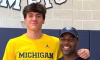 Michigan Wolverines basketball forward J.P. Estrella with Mike Boynton Jr. (Photo by ESPN)