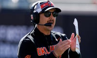 Oklahoma State coach Eric Morris calls a time out during a spring football game for the Oklahoma State University Cowboys at