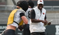 In his opening months in Corvallis, Oregon State football coach JaMarcus Shephard, right, has put an emphasis on making personal